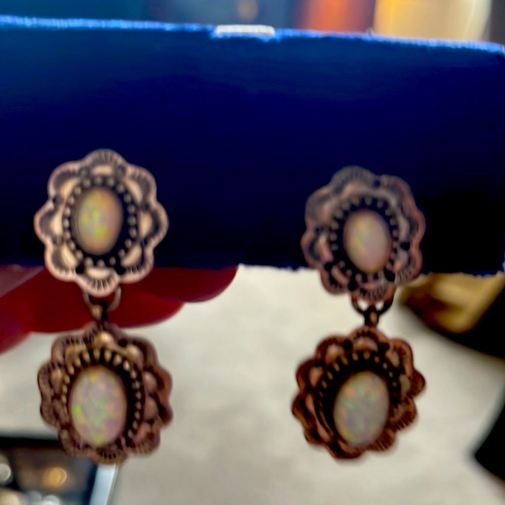 Silver earrings with opal in the middle